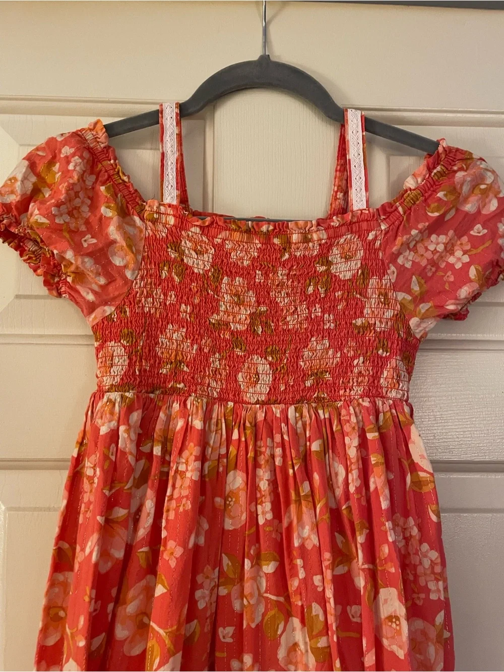 Girls coral floral dress Haute Hippie w/ a smocked bodice, puff sleeve…